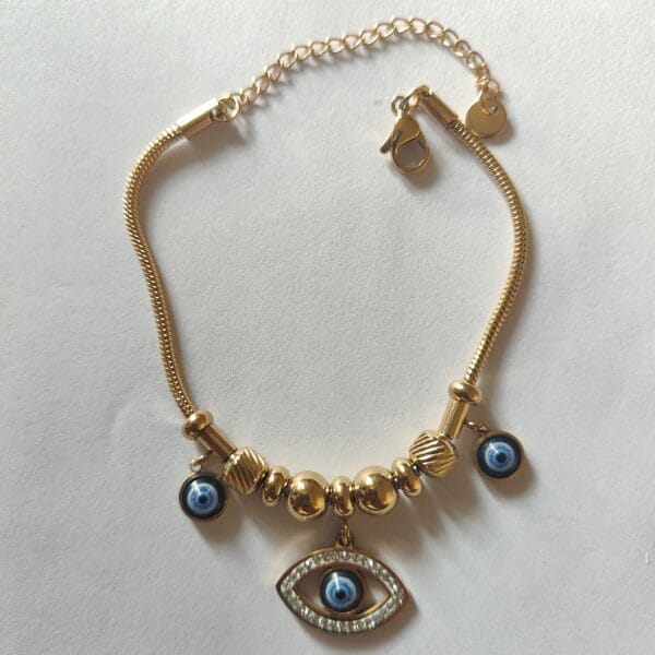 18K gold plated crystal evil eye charm bracelet with gold beads for women tipsy looks