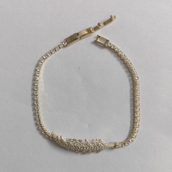18K gold plated crystal tennis bracelet with cubic zirconia feather motif for women tipsy looks