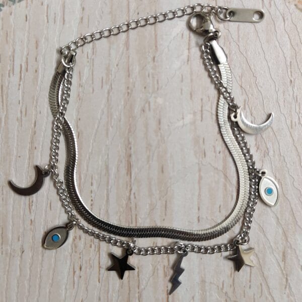Silver layered anti tarnish celestial charm bracelet with evil eye moon and stars for women tipsy looks Anti-tarnish silver layered celestial charm bracelet with evil eye moon and stars for women tipsy looks